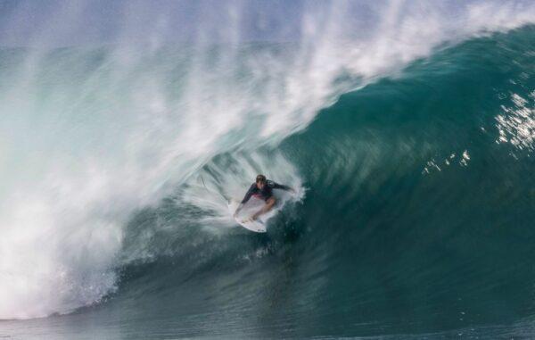 Western Australian surfer Jack Robinson pulls into a deep barrel during the third day of the Da Hui Backdoor Shootout at Pipeline, on the North Shore of Oahu, Hawaii, on January 12, 2022 (Photo by BRIAN BIELMANN/AFP via Getty Images)