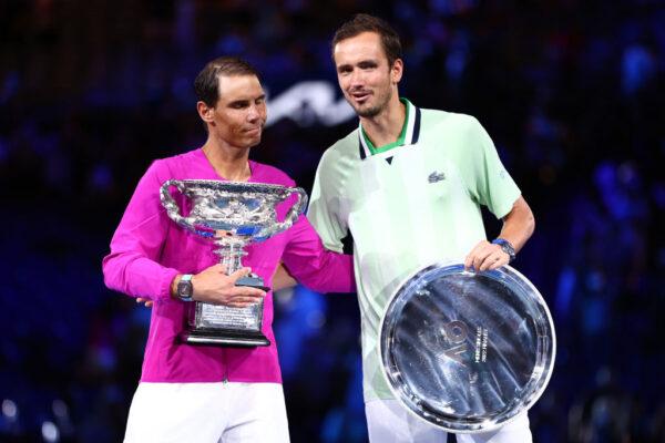 Rafael Nadal (L) and Daniil Medvedev pose during the trophy presentation for the Men’s Singles Final match at the 2022 Australian Open at Melbourne Park in Melbourne, Australia on January 30, 2022 . (Photo by Clive Brunskill/Getty Images)