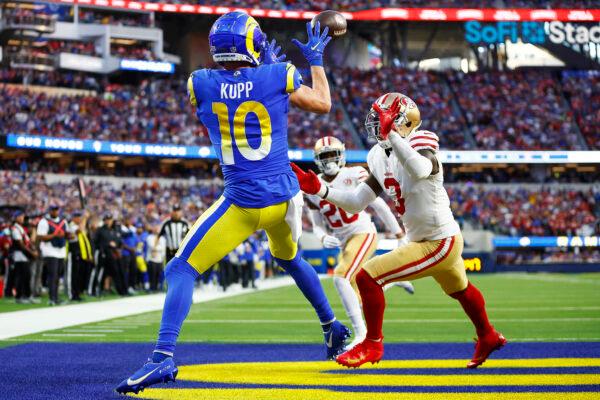 Cooper Kupp #10 of the Los Angeles Rams catches a touchdown in the second quarter against Jaquiski Tartt #3 of the San Francisco 49ers in the NFC Championship Game at SoFi Stadium in Inglewood, Calif., on Jan. 30, 2022. (Ronald Martinez/Getty Images)