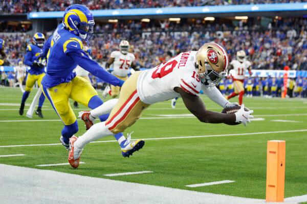 Deebo Samuel #19 of the San Francisco 49ers dives to score a touchdown in the second quarter against Jalen Ramsey #5 of the Los Angeles Rams in the NFC Championship Game at SoFi Stadium in Inglewood, Calif., on Jan. 30, 2022. (Christian Petersen/Getty Images)