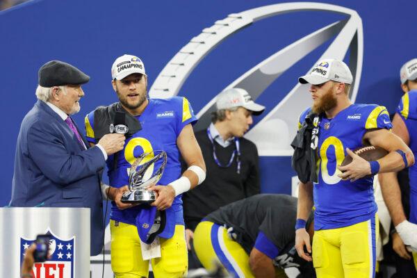 Matthew Stafford #9 of the Los Angeles Rams speaks to Terry Bradshaw while holding the George Halas Trophy as Cooper Kupp #10 looks on after defeating the San Francisco 49ers in the NFC Championship Game at SoFi Stadium in Inglewood, Calif., on Jan. 30, 2022. (Christian Petersen/Getty Images)