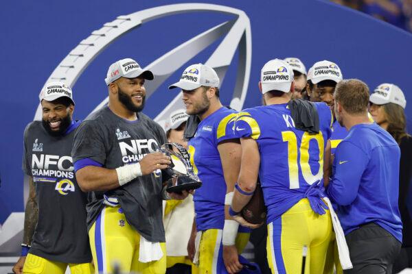 Aaron Donald #99 of the Los Angeles Rams holds the George Halas Trophy after defeating the San Francisco 49ers in the NFC Championship Game at SoFi Stadium in Inglewood, Calif., on Jan. 30, 2022. (Christian Petersen/Getty Images)