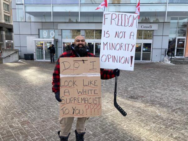 Bal Tiwana, shown in downtown Ottawa on Feb. 1, 2022, drove from Calgary to Ottawa with his wife and young son to attend the protests against vaccine mandates and other restrictions. (Rahul Vaidyanath/The Epoch Times)