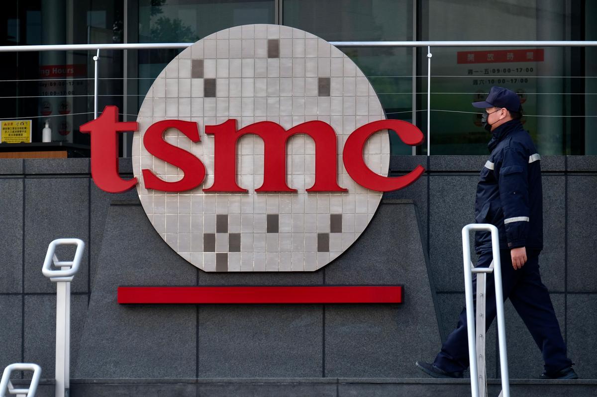 A security guard walks past a company logo at the headquarters of the world's largest semiconductor maker TSMC in Hsinchu on Jan. 29, 2021. (Photo by Sam Yeh / AFP) (Photo by SAM YEH/AFP via Getty Images)