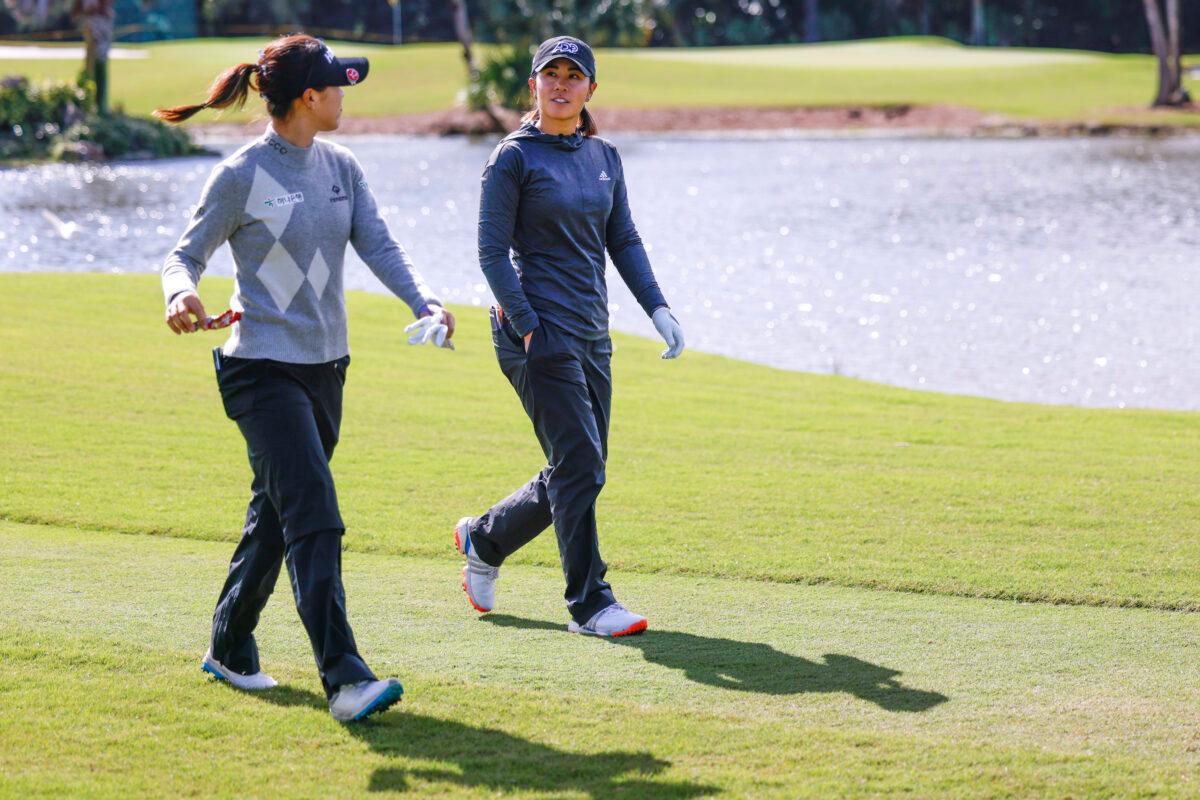 Danielle Kang (R) and Lydia Ko of New Zealand walk on the 16th fairway during the third round of the 2022 Gainbridge LPGA at Boca Rio Golf Club, in Boca Raton, Fla., on Jan. 28, 2022. (Douglas P. DeFelice/Getty Images)