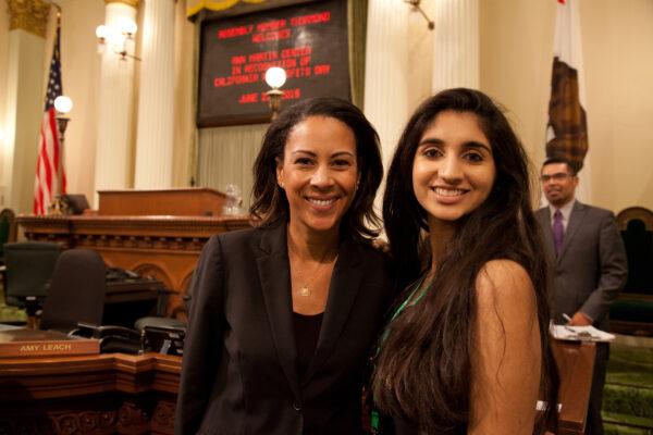 Assembly member Autumn Burke (L) poses for a photo with Gold Award recipient Inaara Biring (R) of Girl Scouts of Greater Los Angeles at the California State Capitol on June 22, 2016, in Sacramento. (Kelly Sullivan/Getty Images for Girl Scouts)