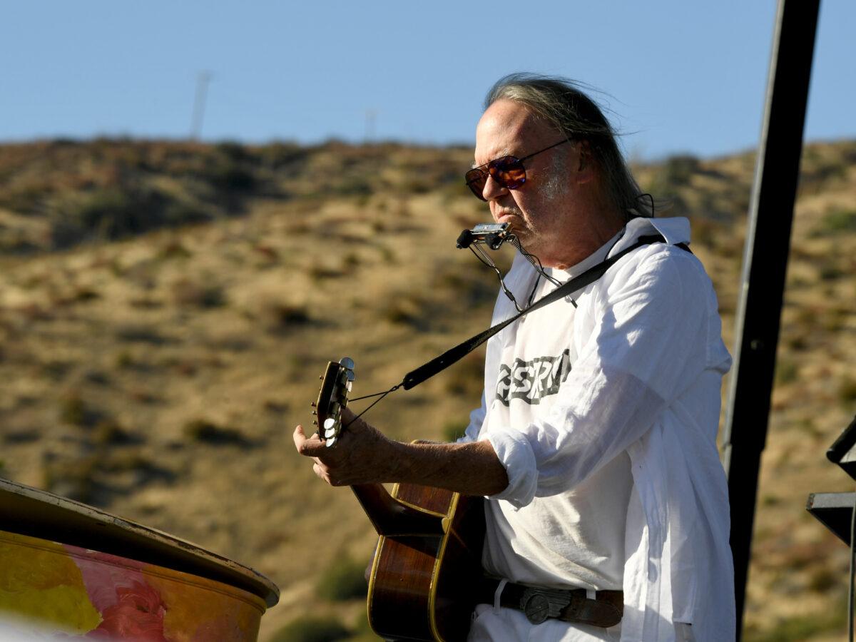 Neil Young performs at Harvest Moon: A Gathering to benefit The Painted Turtle and The Bridge School at Painted Turtle Camp in Lake Hughes, Calif., on Sept. 14, 2019. (Kevin Winter/Getty Images)
