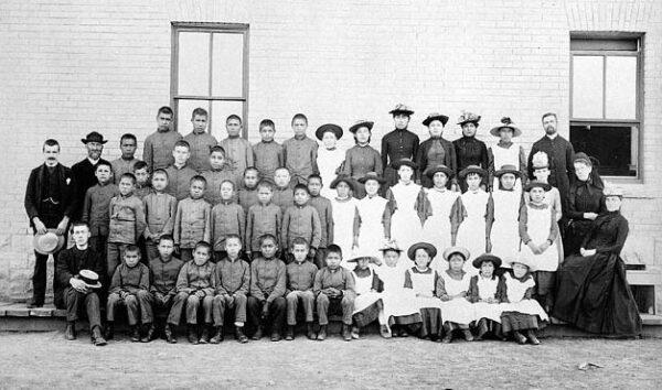 Children and staff at St. Paul's Indian Industrial School in Middlechurch, Manitoba, in 1901. (Public Domain)