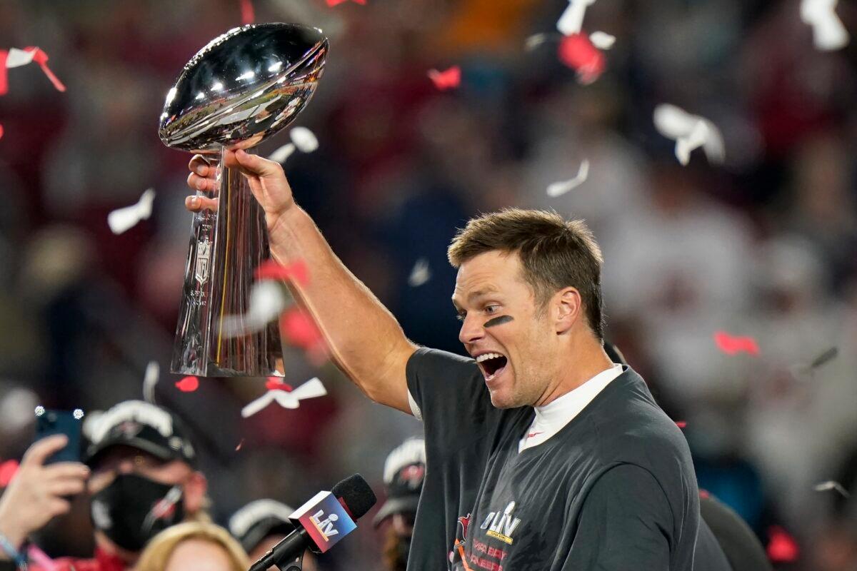 Tampa Bay Buccaneers quarterback Tom Brady celebrates with the Vince Lombardi Trophy after the team's NFL Super Bowl 55 football game against the Kansas City Chiefs in Tampa, Fla., on Feb. 7, 2021. (Lynne Sladky/AP Photo)