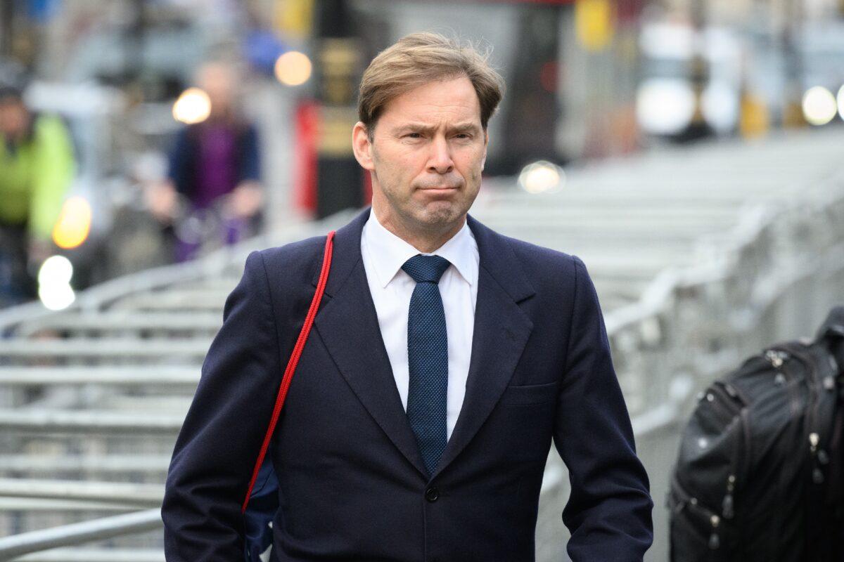 Tobias Ellwood, MP for Bournemouth East, walks through Westminster, in London, on Feb. 2, 2022. (Leon Neal/Getty Images)
