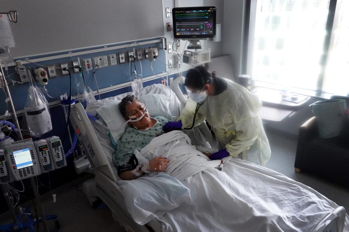 A COVID-19 patient receives treatment at Rush University Medical Center in Chicago on Jan. 31, 2022. (Scott Olson/Getty Images)