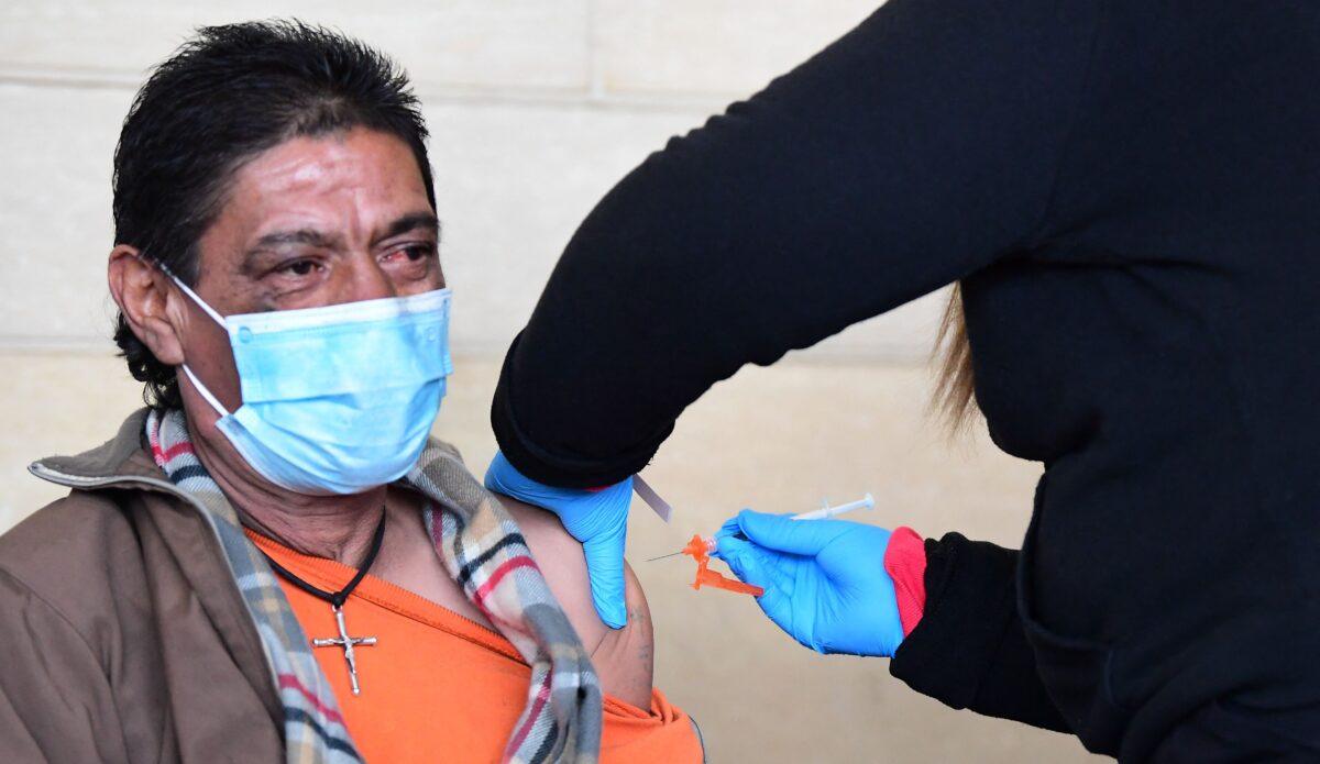 A man gets a dose of a COVID-19 vaccine in Los Angeles, Calif., on Jan. 7, 2022. (Frederic J. Brown/AFP via Getty Images)