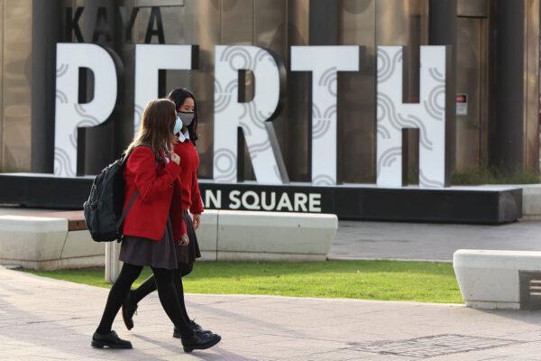 Students walk through Yagan Square in the central business district of Perth, Australia on Apr. 29, 2021. (Photo by Paul Kane/Getty Images)