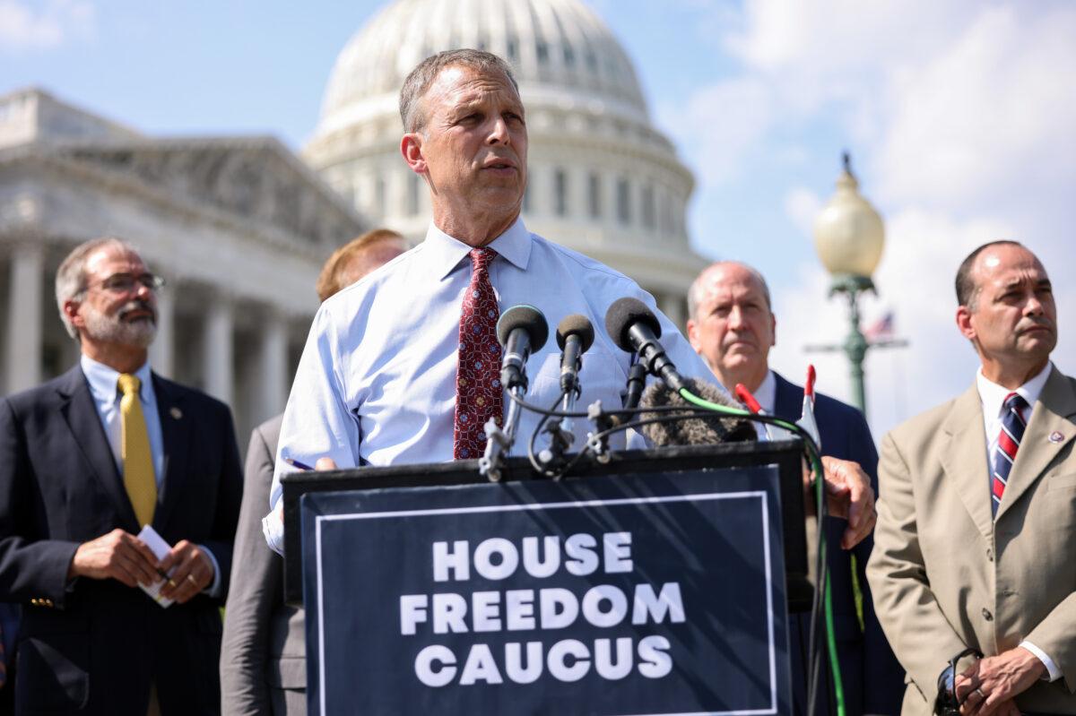 Rep. Scott Perry (R-Pa.), joined by members of the House Freedom Caucus, speaks at a news conference on the infrastructure bill outside the Capitol Building in Washington on Aug. 23, 2021. (Kevin Dietsch/Getty Images)