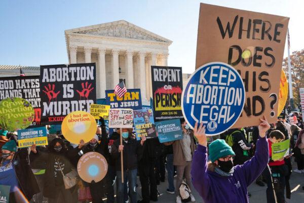 Demonstrators gather in front of the U.S. Supreme Court as the justices hear arguments in Dobbs v. Jackson Women's Health, a case about a Mississippi law that bans most abortions after 15 weeks, in Washington, on Dec. 1, 2021. (Chip Somodevilla/Getty Images)