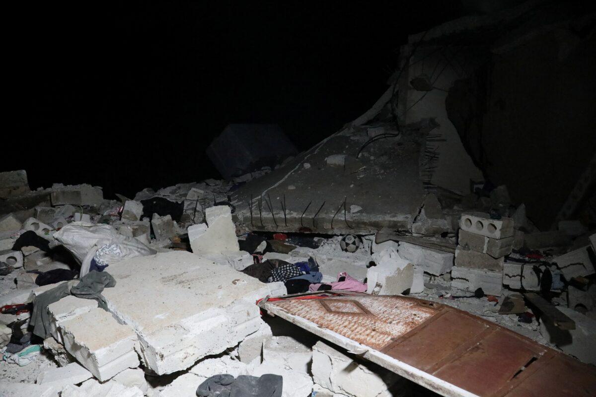 In a picture obtained from social media, debris and rubble are seen in the aftermath of a counterterrorism mission conducted by the U.S. special operations forces in Atmeh, Syria, on Feb. 3, 2022. (Courtesy of Mohamed Al-Daher via Reuters)