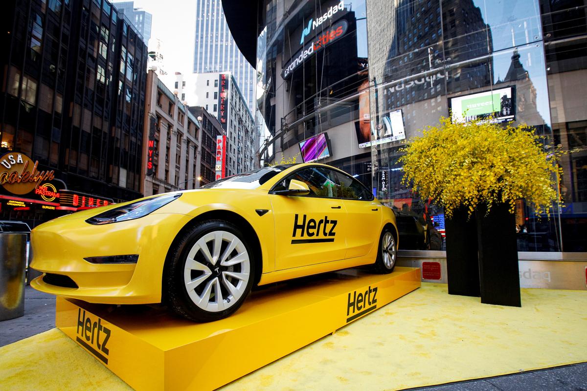 A Hertz Tesla electric vehicle is displayed during the Hertz Corporation IPO at the Nasdaq Market site in Times Square in New York, on Nov. 9, 2021. (Brendan McDermid/Reuters)