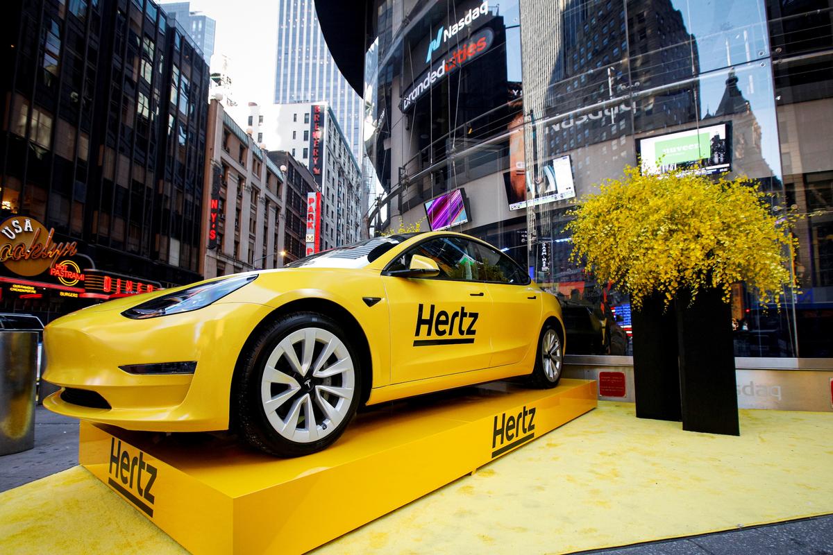 A Hertz Tesla electric vehicle is displayed during the Hertz Corporation IPO at the Nasdaq Market site in Times Square in New York on Nov. 9, 2021. (Brendan McDermid/Reuters)