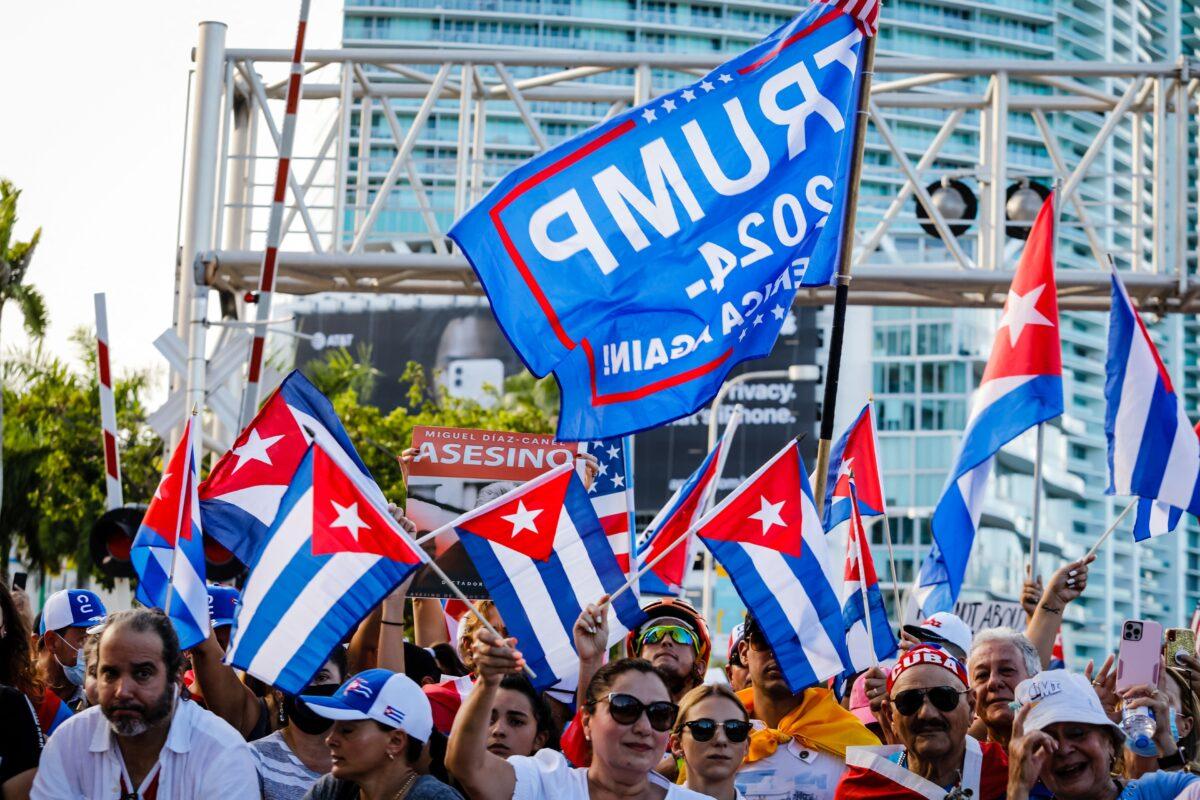 A Trump 2024 flag is seen as people wave Cuban and US flags during a Freedom Rally showing support for Cubans demonstrating against communist dictatorship, at Freedom Tower in Miami, on July 17, 2021. (Eva Marie Uzcategui/AFP via Getty Images)