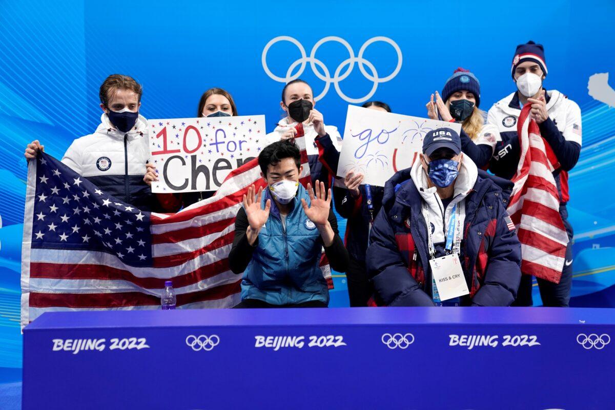 The team cheers for Nathan Chen of the United States during the men's singles short program team event in the figure skating competition at the 2022 Winter Olympics in Beijing on Feb. 4, 2022. (David J. Phillip/AP Photo)