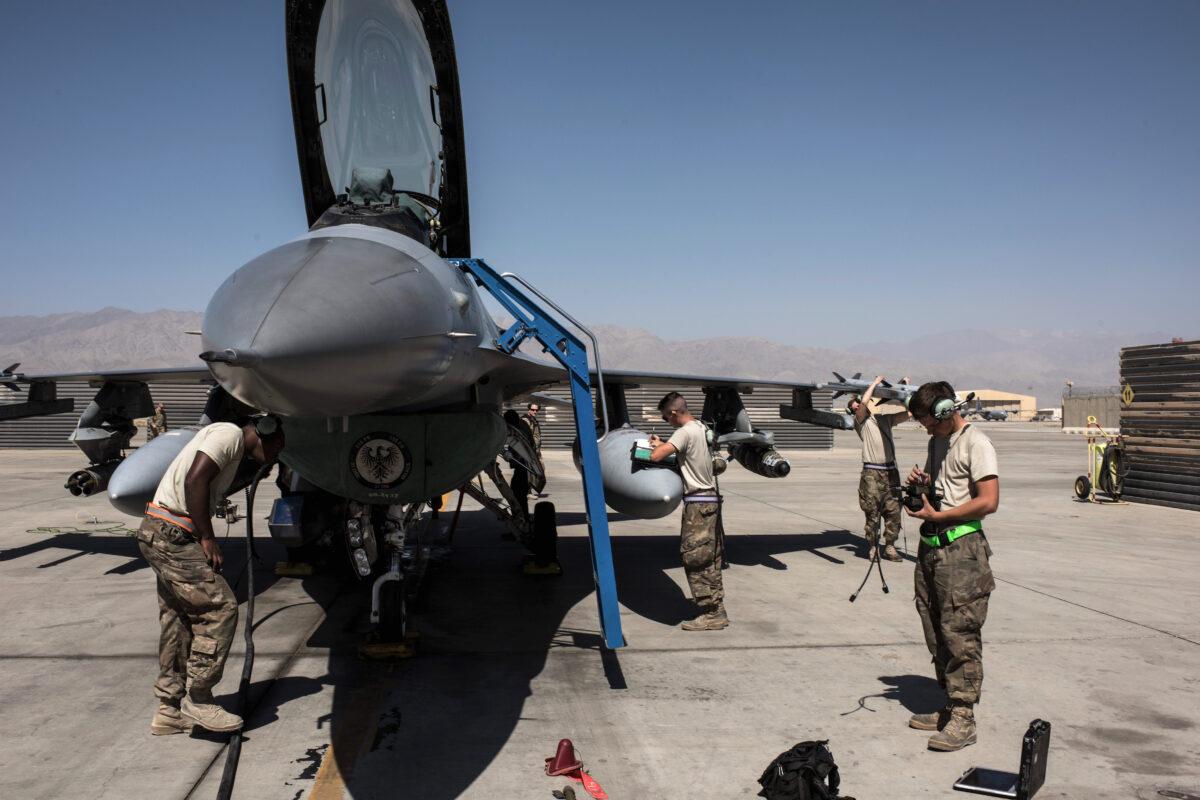 Members of the United States Air Force deployed for Mission Resolute Support prepare an F-16 Jet for a flight at Bagram Airfield on Sept. 5, 2017. (Andrew Renneisen/Getty Images)