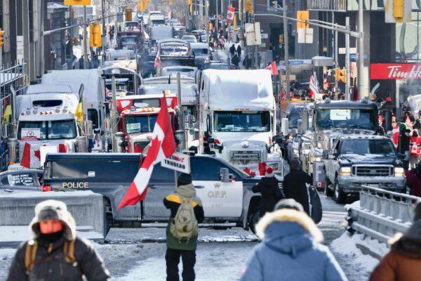 Trucks and other vehicles are parked close to Parliament Hill in Ottawa as protesters gather to demonstrate against COVID-19 mandates and restrictions on Feb. 5, 2022. (Jonathan Ren/The Epoch Times)