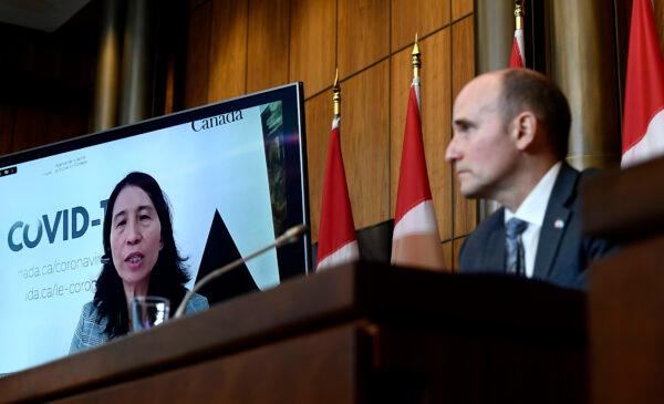 Chief Public Health Officer of Canada Dr. Theresa Tam is seen via videoconference as Minister of Health Jean-Yves Duclos looks on during a news conference on the COVID-19 pandemic and the omicron variant, in Ottawa, on Jan. 7, 2022. (The Canadian Press/Justin Tang)