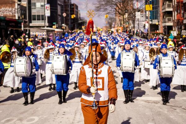 Falun Gong practitioners take part in the annual Chinese Lunar New Year parade in the Flushing neighborhood in Queens, N.Y., on Feb. 5, 2022. (Samira Bouaou/The Epoch Times)