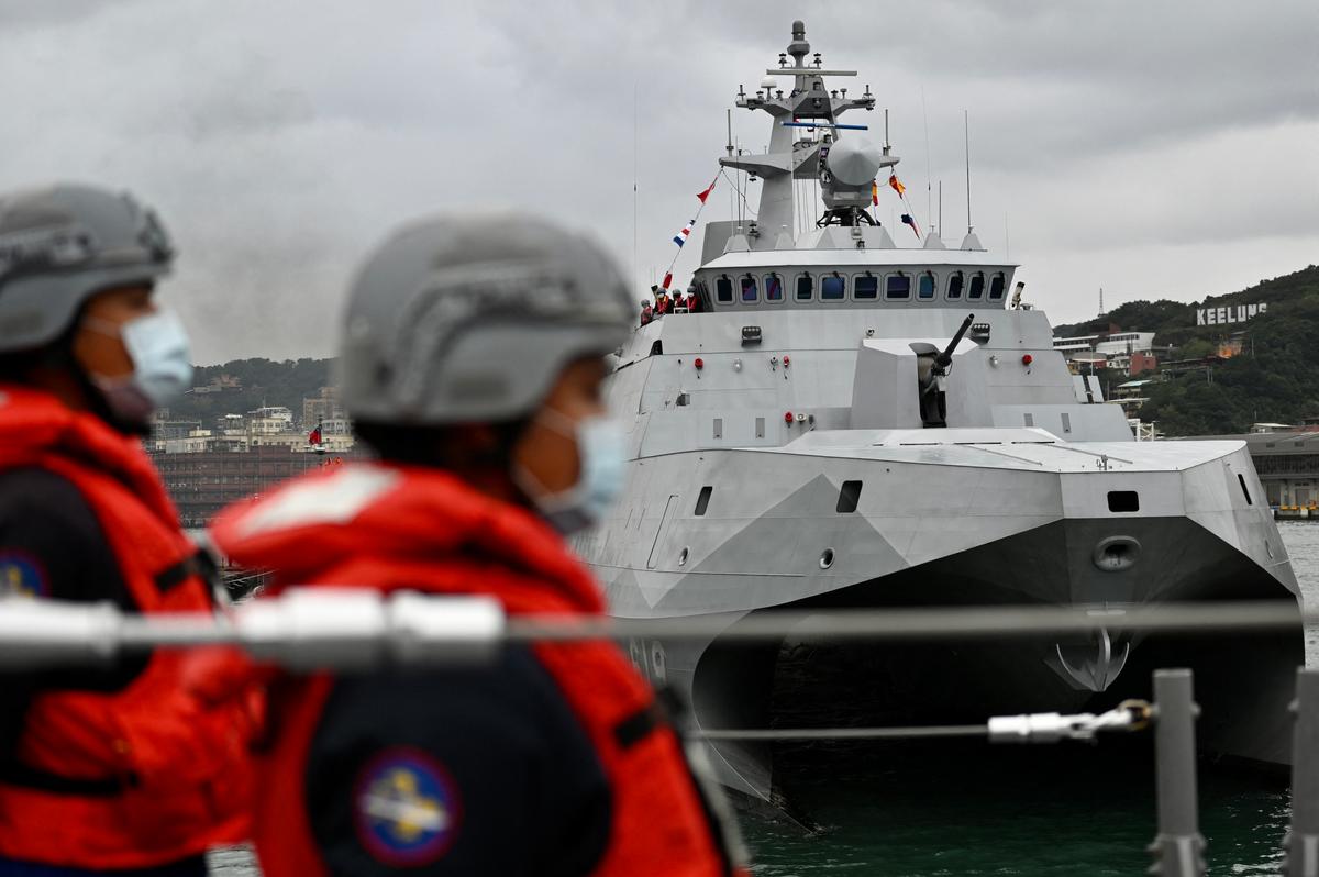 Taiwan soldiers stand next to the domestically produced corvette class vessel Tuo Chiang (R) during a drill at the northern city of Keelung, Taiwan, on Jan. 7, 2022. (SAM YEH/AFP via Getty Images)