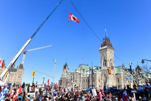 Thousands gather around Parliament Hill in support of the Freedom Convoy truck protest in Ottawa on Feb. 5, 2022. (Minas Panagiotakis/Getty Images)