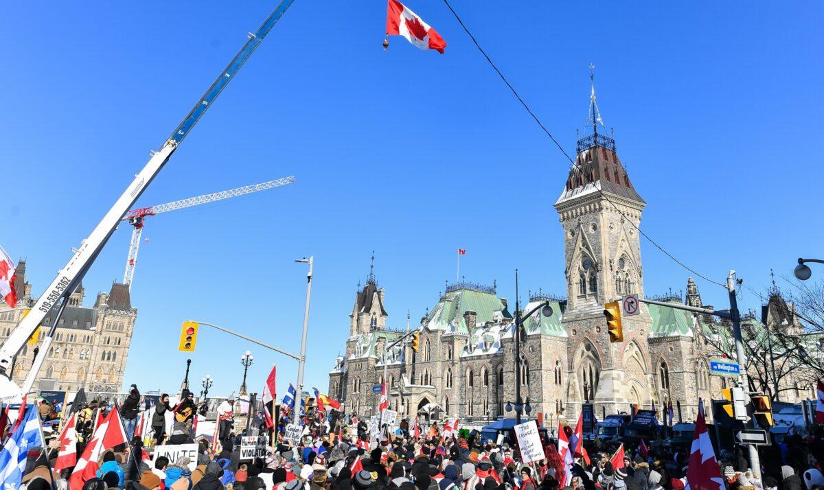 Thousands gather around Parliament Hill in support of the Freedom Convoy truck protest in Ottawa on Feb. 5, 2022. (Minas Panagiotakis/Getty Images)