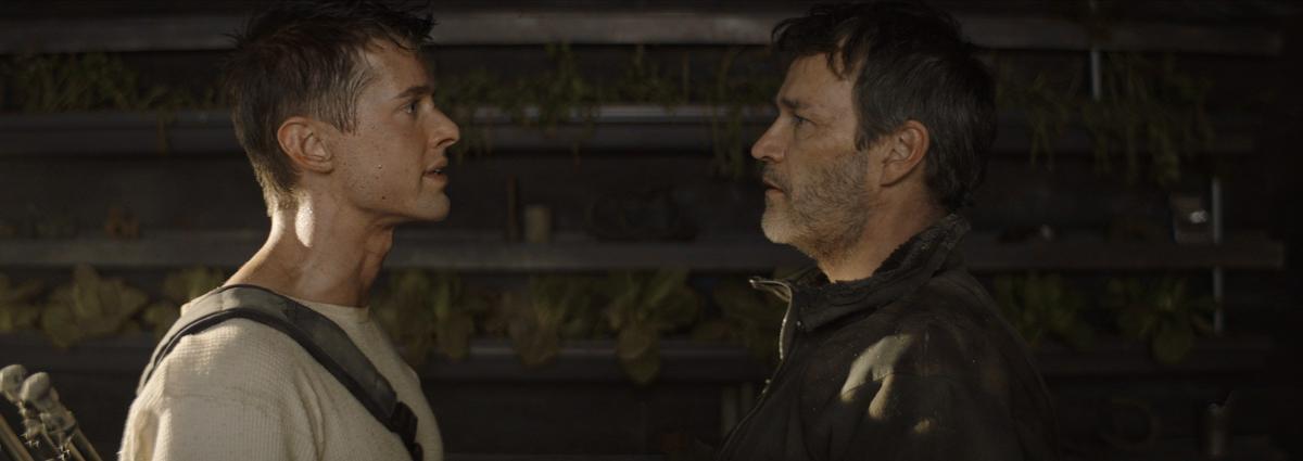 Son Jake (Drew Van Acker, L) and father Troy (Stephen Moyer) are wilderness survivalists, in "Last Survivors." (Vertical Entertainment)