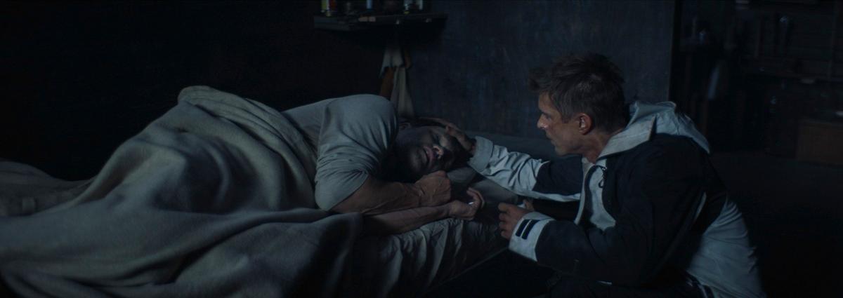  Son Jake (Drew Van Acker, R) cares for his gut-shot father Troy (Stephen Moyer), in "Last Survivors." (Vertical Entertainment)