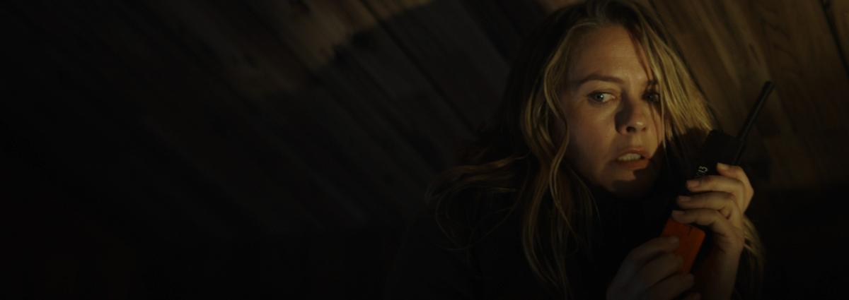  Henrietta (Alicia Silverstone) calls for help in her attic, in "Last Survivors." (Vertical Entertainment)
