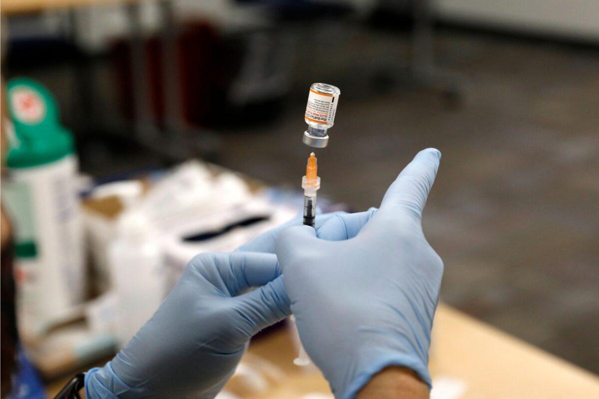 A nurse prepares the Pfizer COVID-19 vaccine in Southfield, Mich., on Nov. 5, 2021. (Jeff Kowalsky/AFP via Getty Images)