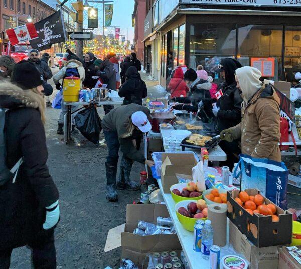 Volunteers provide free food and drinks to protesters demonstrating against COVID-19 mandates and restrictions in Ottawa on Feb. 5, 2022. (Courtesy of Simon Alary)