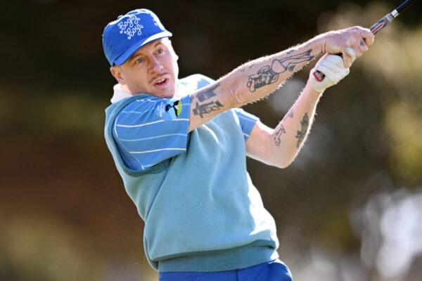 Musician Macklemore plays his shot from the fifth tee during the first round of the AT&T Pebble Beach Pro-Am at Monterey Peninsula Country Club, in Pebble Beach, Calif., on February 3, 2022. (Orlando Ramirez/Getty Images)