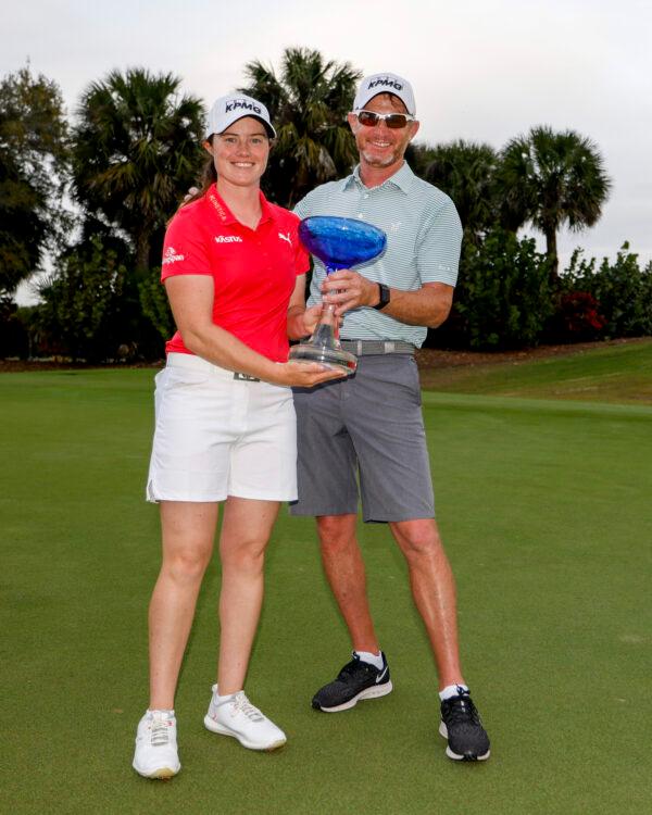 Leona Maguire of Ireland poses with her caddy Dermot Bryne after winning the LPGA Drive On Championship at Crown Colony Golf & Country Club, in Fort Myers, Fla., on Feb. 5, 2022. (Douglas P. DeFelice/Getty Images)