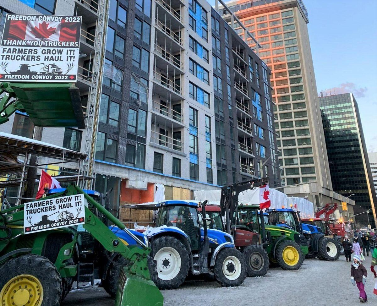  Farm vehicles joining the trucker convoy protest against COVID-19 mandates parked in Ottawa, Canada, on Feb. 5, 2022. (Courtesy of Simon Alary)