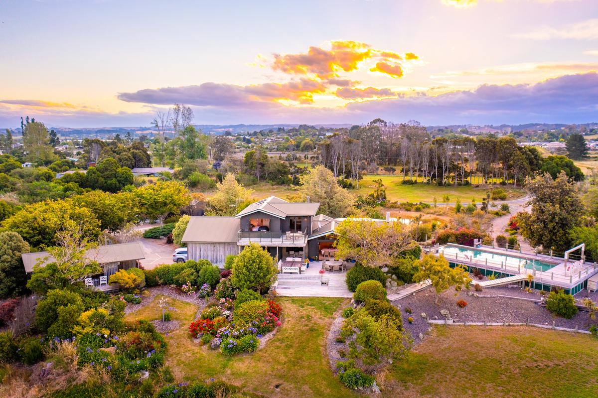 A drone view at dusk reveals the town and estuary to the west. While the estate offers a feeling of total seclusion, it’s only a short stroll to Mapua town and the amenities there. (New Zealand Sotheby’s International Realty)