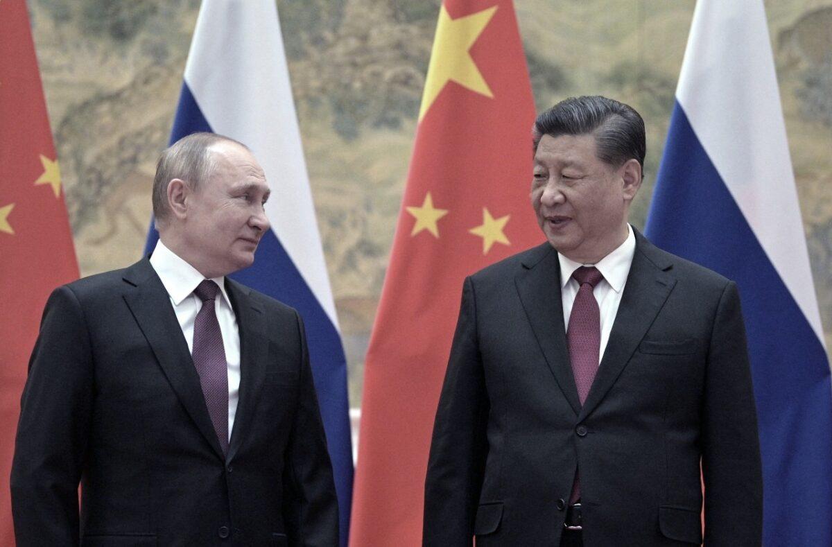  Russian President Vladimir Putin and Chinese leader Xi Jinping pose for a photograph during their meeting in Beijing on Feb. 4, 2022. (Alexei Druzhinin/Sputnik/AFP via Getty Images)