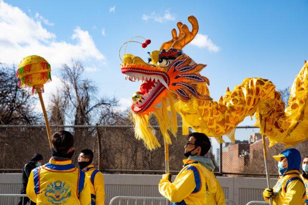 Falun Gong practitioners participate in the Chinese New Year Parade in Flushing, New York, on Feb. 5, 2022. (Chung I Ho/The Epoch Times)