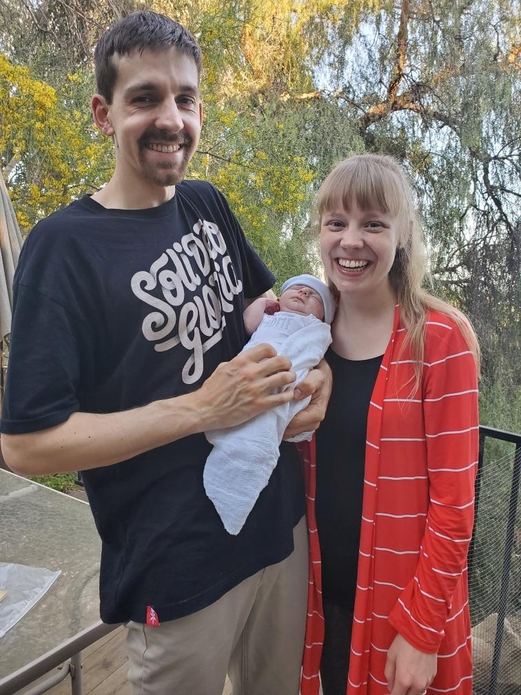 Caleb (L) and Abigail Ostrom with their newborn baby son. (Courtesy of Abigail Ostrom)
