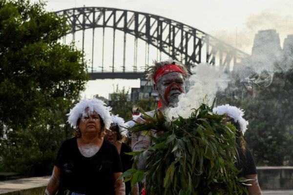Koomurri-Bujja Bujja dancers arrive for the smoking ceremony during the WugulOra Morning Ceremony as part of Australia Day 2022 celebrations at Walumil Lawns in Sydney, Australia, on Jan. 26, 2022. (Bianca De Marchi/Pool/Getty Images)