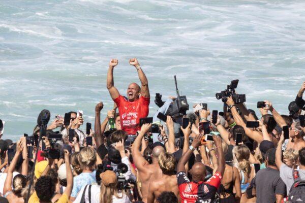 Kelly Slater celebrates victory during the final day of the Billabong Pipeline Pro, on the north shore of Oahu, Hawaii, on February 5, 2022.(Photo by BRIAN BIELMANN/AFP via Getty Images)