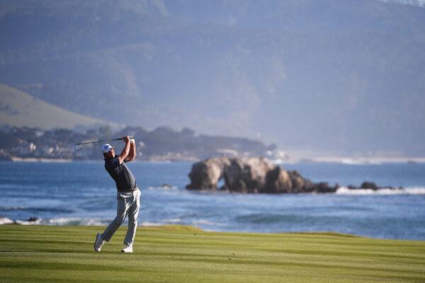 Tom Hoge of the United States plays his second shot on the 18th hole during the final round of the AT&T Pebble Beach Pro-Am at Pebble Beach Golf Links, in Pebble Beach, Calif., on Feb. 6, 2022. (Orlando Ramirez/Getty Images)