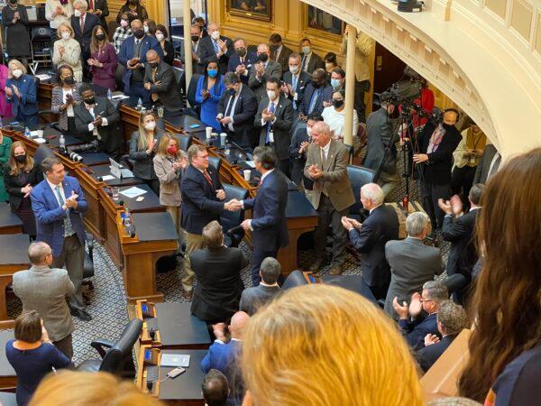 Del. Wren Williams shakes hands with Gov. Glenn Youngkin during the governor's Joint Address of the General Assembly in Richmond, Va., on Jan. 17, 2022. (Courtesy of Addison Merryman)