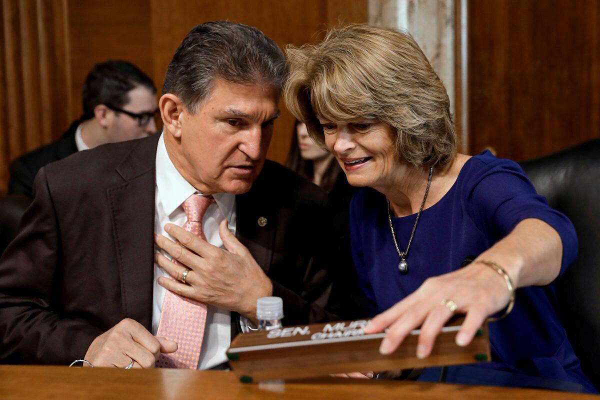 Sens. Joe Manchin (D-W.Va.) and Lisa Murkowski (R-Alaska) chat before a Senate Energy and Natural Resources Committee nomination hearing for former energy lobbyist David Bernhardt to be Interior secretary on Capitol Hill in Washington on March 28, 2019. (Yuri Gripas/File Photo Reuters)