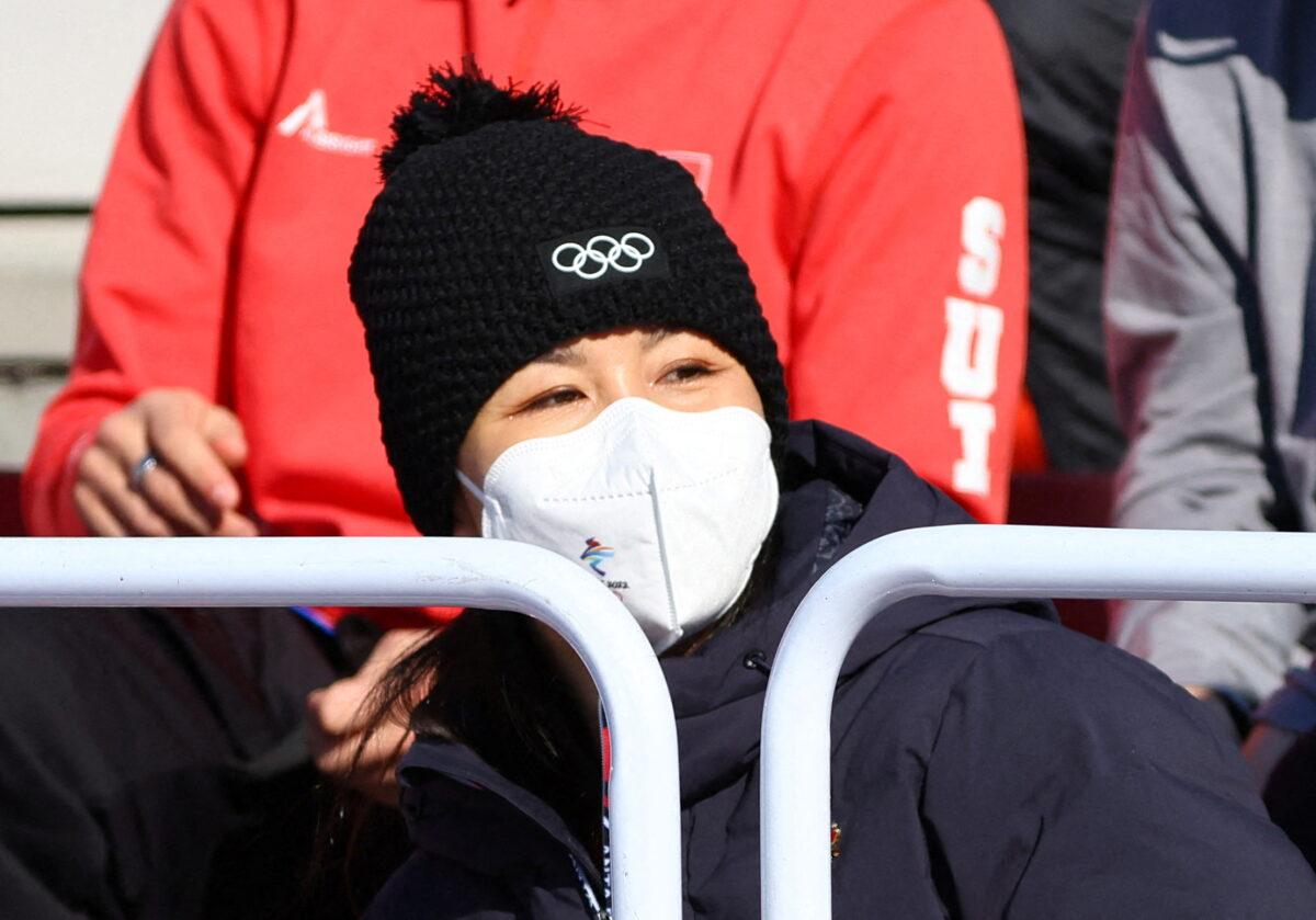 China's Peng Shuai wearing a face mask watches the Women's Freeski Big Air final in Beijing on Feb. 8, 2022. (Fabrizio Bensch/Reuters)