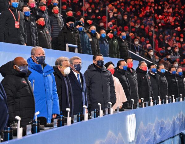 China's President Xi Jinping (5-L), party leaders, and guests of International Olympic Committee (IOC) President Thomas Bach attend the opening ceremony of the Beijing 2022 Winter Olympic Games at the National Stadium, known as the Bird's Nest, in Beijing, on February 4, 2022. (Yue Yuewei / POOL/AFP via Getty Images)